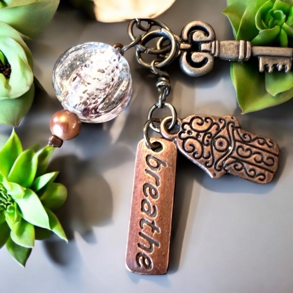 Unique bronze necklace key and charm details clear glass bead and 'breathe' tag. - Picture 4 of 15